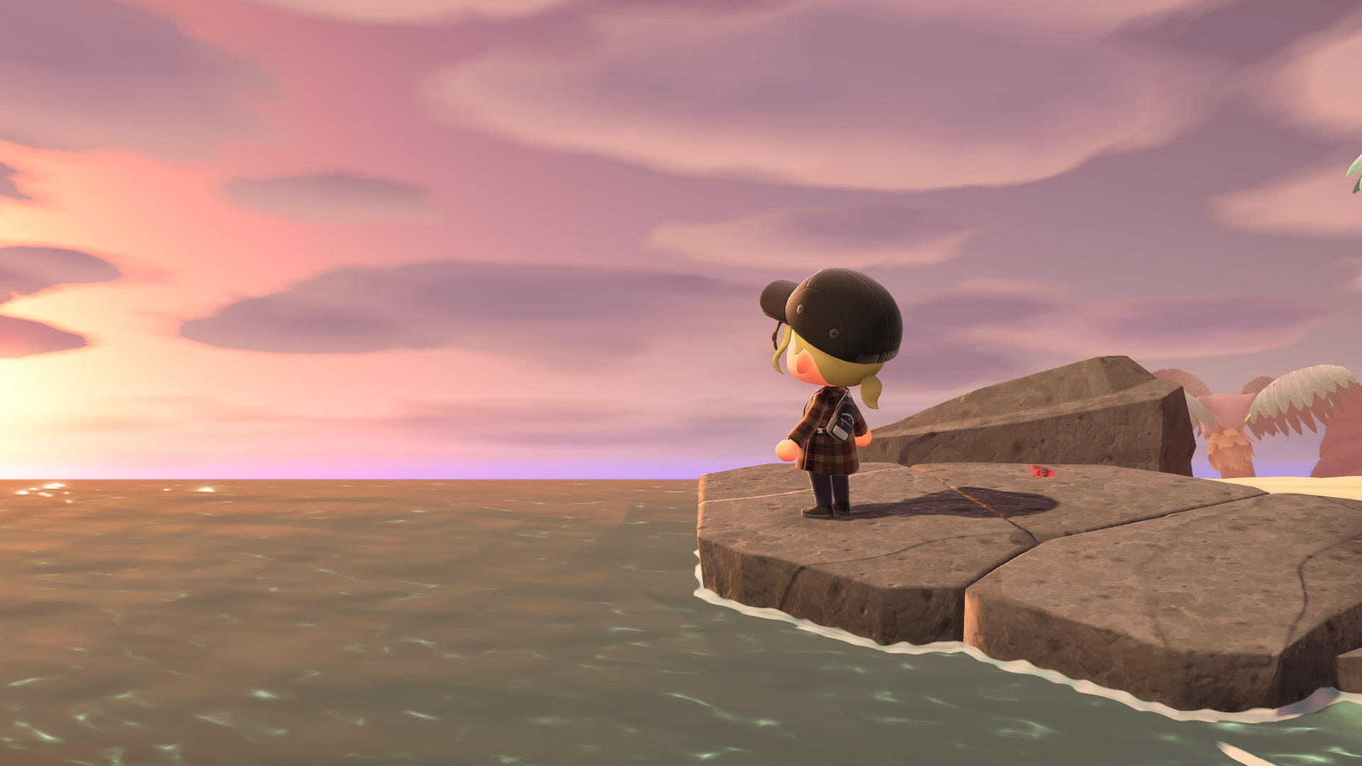 Coucher de soleil depuis la plage d'Animal Crossing New Horizons.