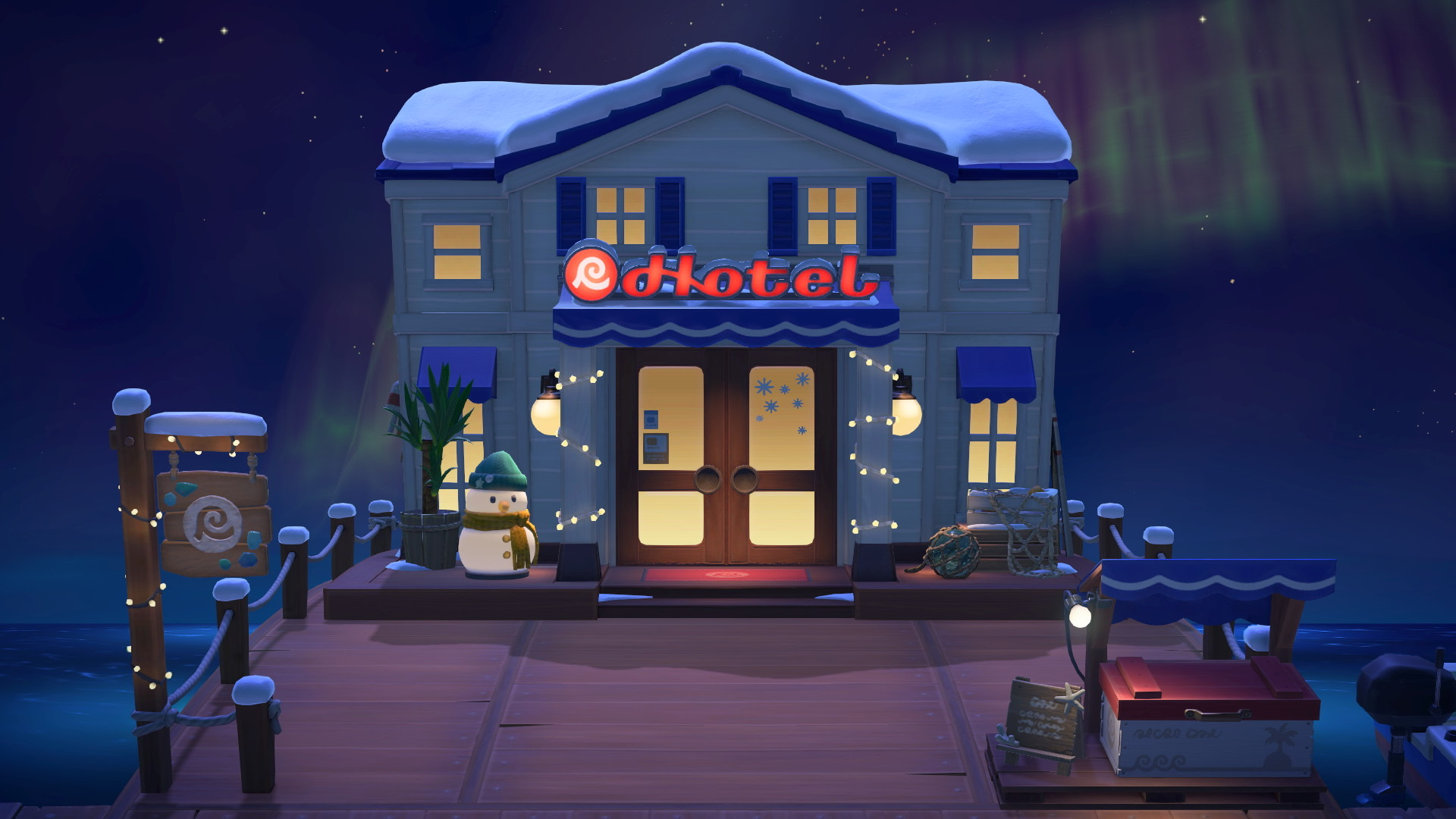 Devanture de l'hôtel par une nuit d'hiver dans Animal Crossing New Horizons sur Nintendo Switch 2. Devanture de l'hôtel par une nuit d'hiver dans Animal Crossing New Horizons sur Nintendo Switch 2.