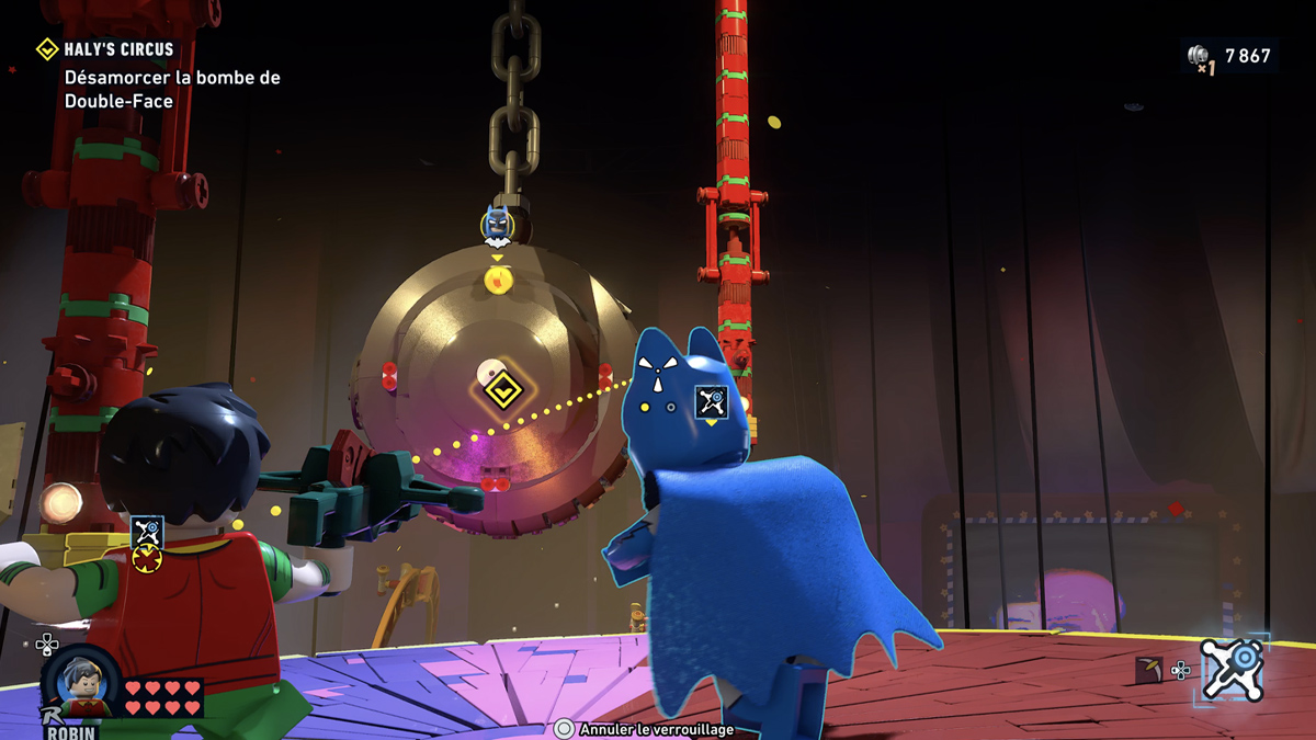 Robin utilise son lance-cÃ¢ble au cirque dans lego batman.