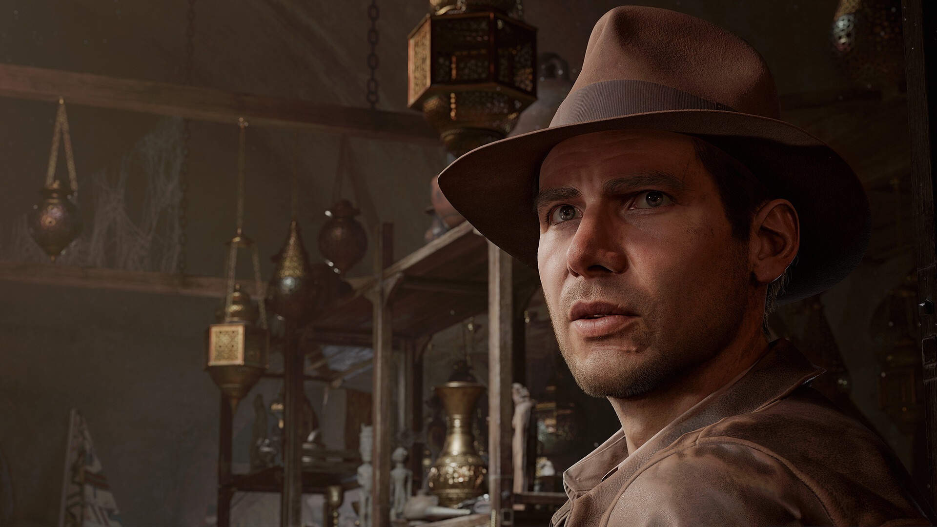 Capture d'Ã©cran de la version PC d'Indiana Jones et le Cercle Ancien avec un gros plan sur le visage modÃ©lisÃ© d'Harrison Ford. 